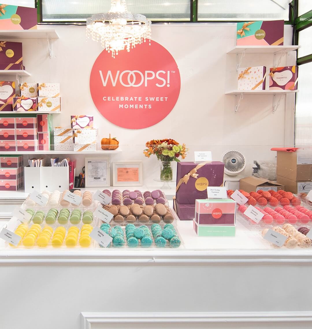 Woops! Booth at Bryant Park filled with colorful macarons and gift boxes