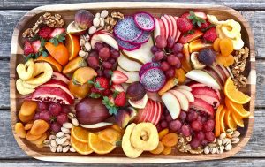 Fresh fruit platter with assorted fruits.
