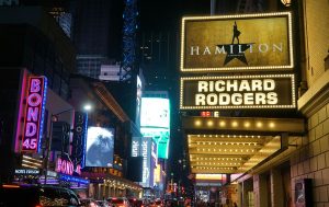 Broadway billboards and Times Square to the left. 