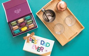A cocktail kit, with an opened macarons box and a “Best Dad ever” box.