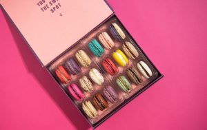 A Woops! gift box opened with macarons.